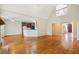 Open-concept living area with hardwood floors and view of kitchen and entry foyer at 540 Clubfield Drive, Roswell, GA 30075