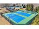 Aerial view of well-maintained tennis courts with viewing area at 540 Clubfield Drive, Roswell, GA 30075