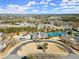 Aerial showcasing pool, clubhouse, and tennis courts, highlighting community amenities at 4000 Bethelview Ln, Suwanee, GA 30024