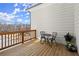 Relaxing back porch with patio furniture, wood floors, and a scenic neighborhood view at 4000 Bethelview Ln, Suwanee, GA 30024