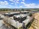 Aerial view of a commercial/business park with multiple buildings, parking, and green spaces at 4000 Bethelview Ln, Suwanee, GA 30024