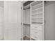 This walk-in closet features custom shelving, drawers, and ample storage space at 4000 Bethelview Ln, Suwanee, GA 30024