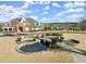 Stunning brick clubhouse with water feature, showcasing community amenities and landscape at 4000 Bethelview Ln, Suwanee, GA 30024