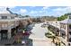 Inviting shopping center street view with parallel parking and diverse storefronts on a sunny day at 4000 Bethelview Ln, Suwanee, GA 30024