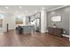 Open-concept kitchen with a spacious island, stainless steel appliances, and hardwood floors at 4000 Bethelview Ln, Suwanee, GA 30024