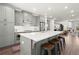 Open kitchen with gray cabinets, white countertops, stainless steel appliances, and an eat-in island at 4000 Bethelview Ln, Suwanee, GA 30024