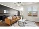 Comfortable living room featuring hardwood floors, neutral palette, and bright windows at 4000 Bethelview Ln, Suwanee, GA 30024