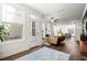 Spacious living room showcasing natural light, hardwood floors and easy backyard access at 4000 Bethelview Ln, Suwanee, GA 30024