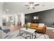 Stylish living room boasts a brown leather couch, modern decor, and a neutral palette at 4000 Bethelview Ln, Suwanee, GA 30024