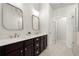 Modern main bathroom with double sinks, a large mirror, and glass enclosed shower at 4000 Bethelview Ln, Suwanee, GA 30024