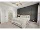 Calm main bedroom that leads into a bathroom with a large tub and a glass enclosed shower at 4000 Bethelview Ln, Suwanee, GA 30024