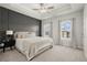 Stately main bedroom featuring a tray ceiling, calming gray tones, and plenty of natural light at 4000 Bethelview Ln, Suwanee, GA 30024