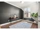 A serene room with modern decor, hardwood floors, and a large window at 4000 Bethelview Ln, Suwanee, GA 30024