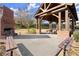 Outdoor pavilion with fireplace, brick pillars, and picnic tables, perfect for community gatherings at 4000 Bethelview Ln, Suwanee, GA 30024