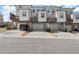 Three-story townhomes featuring private garages and balconies with stylish gray and white exteriors at 4000 Bethelview Ln, Suwanee, GA 30024