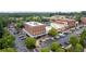 Aerial view of storefronts and businesses with convenient parking, surrounded by lush greenery at 7315 Cordery Rd, Cumming, GA 30040