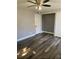 This bedroom features hardwood-style floors, neutral paint, ceiling fan, and a closet area at 330 9Th Ne St # 11, Atlanta, GA 30309
