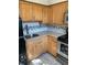 Compact kitchen features light-colored cabinetry, stainless steel appliances, and tiled backsplash and flooring at 330 9Th Ne St # 11, Atlanta, GA 30309