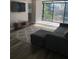 Bright living room with large windows, modern flooring, and stylish rug at 330 9Th Ne St # 11, Atlanta, GA 30309