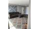 Comfortable living room with grey sectional couch, wooden accent wall and a patterned rug on the hardwood floor at 330 9Th Ne St # 11, Atlanta, GA 30309