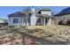 The back exterior of the home has lots of windows, a covered patio, and a large yard at 1541 Towne Park Ct, Lawrenceville, GA 30044