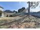 View of a fenced backyard with large mature trees at 1541 Towne Park Ct, Lawrenceville, GA 30044