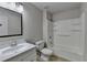 Cozy bathroom featuring a single sink vanity and shower-tub combination at 1541 Towne Park Ct, Lawrenceville, GA 30044