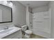 Cozy bathroom featuring a single sink vanity and shower-tub combination at 1541 Towne Park Ct, Lawrenceville, GA 30044