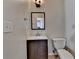 Cozy bathroom with modern vanity, framed mirror, and toilet at 1541 Towne Park Ct, Lawrenceville, GA 30044