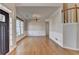 Dining room featuring hardwood floors, wainscoting, and a staircase at 1541 Towne Park Ct, Lawrenceville, GA 30044