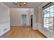 Dining room with hardwood floors, a chandelier, and wainscoting at 1541 Towne Park Ct, Lawrenceville, GA 30044