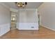 Dining room with hardwood floors and wainscoting with kitchen in the background at 1541 Towne Park Ct, Lawrenceville, GA 30044