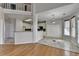 A spacious kitchen with an eat in area features white cabinetry, stainless appliances and natural light at 1541 Towne Park Ct, Lawrenceville, GA 30044
