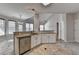 Open kitchen with stainless steel appliances, granite countertops and spacious marble-style floors at 1541 Towne Park Ct, Lawrenceville, GA 30044