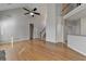 This open living room features hardwood floors, a vaulted ceiling, and a staircase at 1541 Towne Park Ct, Lawrenceville, GA 30044