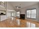 This open living room features hardwood floors, a vaulted ceiling and a stone fireplace at 1541 Towne Park Ct, Lawrenceville, GA 30044