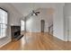 This open living room features hardwood floors, a vaulted ceiling and a stone fireplace at 1541 Towne Park Ct, Lawrenceville, GA 30044