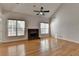 This open living room features hardwood floors and a stone fireplace at 1541 Towne Park Ct, Lawrenceville, GA 30044