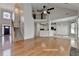 Bright living room with hardwood floors, large windows and an open floor plan with stairs to the second level at 1541 Towne Park Ct, Lawrenceville, GA 30044
