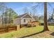 Home exterior featuring a wooden deck and spacious backyard with a wooden fence at 2745 Davenport Rd, Duluth, GA 30096