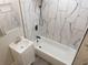 Modern bathroom features striking marble-style tiled walls, complemented by matte black fixtures at 444 Sargent Se Dr, Atlanta, GA 30315
