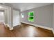Neutral bedroom featuring hardwood flooring, white trim and large windows with natural light at 444 Sargent Se Dr, Atlanta, GA 30315