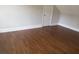 Bedroom with dark hardwood floors and white trim against gray walls at 444 Sargent Se Dr, Atlanta, GA 30315
