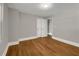 Cozy bedroom features hardwood floors, white trim, and neutral wall color at 444 Sargent Se Dr, Atlanta, GA 30315