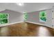 Spacious bedroom featuring hardwood flooring and ample natural light from multiple windows at 444 Sargent Se Dr, Atlanta, GA 30315