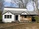 Charming bungalow with a covered porch and a carport on a spacious lot at 444 Sargent Se Dr, Atlanta, GA 30315