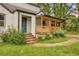 Close-up of a charming home's entrance with a covered porch and brick accents at 444 Sargent Se Dr, Atlanta, GA 30315