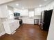 Modern kitchen with white cabinets, stainless steel appliances, and marble countertops at 444 Sargent Se Dr, Atlanta, GA 30315