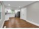 Bright kitchen featuring white cabinets, stainless steel appliances, and hardwood flooring at 444 Sargent Se Dr, Atlanta, GA 30315