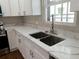 Modern kitchen sink area with stainless steel fixtures and sleek countertops at 444 Sargent Se Dr, Atlanta, GA 30315